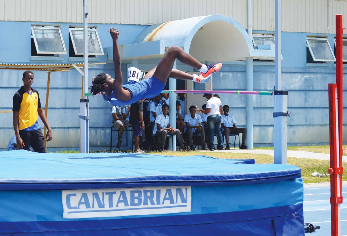 Female high jumper in action at the qualifiers