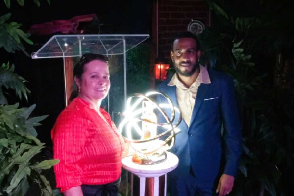 PCD management staffers, Sales Manager Linda Hippolyte (left) and Brand Activation Manager (Hennessy), Manduchi Mangal unveil the Henny White bottle edition