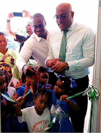 MP for Gros-Islet Kenson Casimir and Education Minister Shawn Edward cut the ribbon to officially reopen the facility 