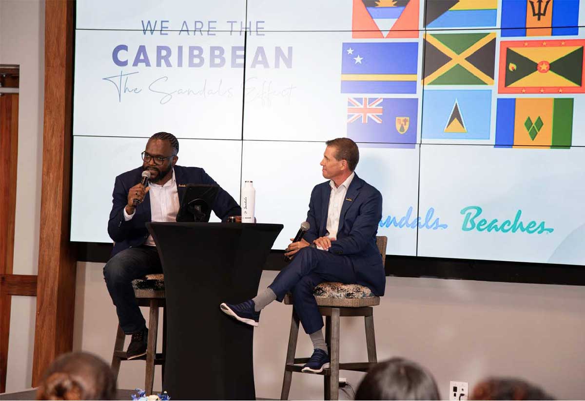 Executive Chairman for Sandals Resorts International, Adam Stewart (right) and Corporate Manager, Employee Experience, Jamie Green engage in a spirited and interactive discussion during the company’s recent town hall meeting