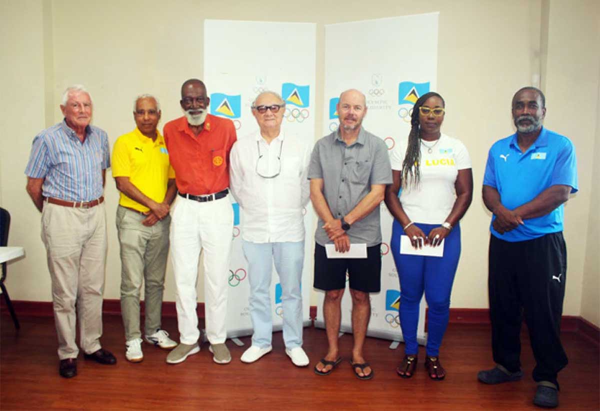 SLOC Inc. President, Alfred Emmanuel, far right, flanked by Dora Henry, First Vice-President, St. Lucia Athletics Association; Frank Chevrier, Vice-President of the Saint Lucia Sailing Association; Stephen Mc Namara, President, St. Lucia National Tennis Association; Digby Ambris, Vice-President of the St. Lucia National Tennis Association; Teddy Matthews, Secretary General of SLOC Inc.; and John Bruce, Treasurer of the St. Lucia Life Saving Association, at the check handover ceremony on Saturday, June 8, 2024.