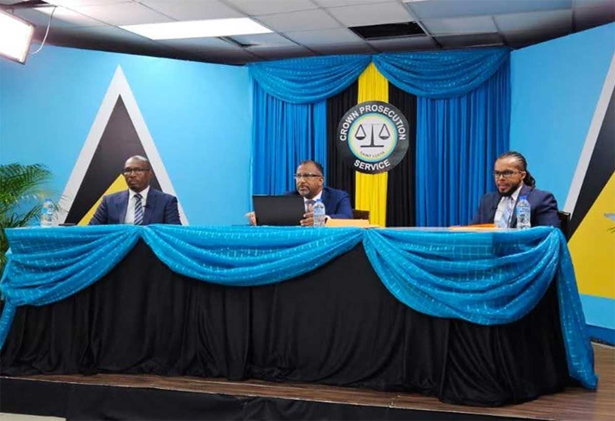 DPP Daarsrean Greene flanked by Crown Counsels Curtis Raphael (left) and Linton Robinson (right)