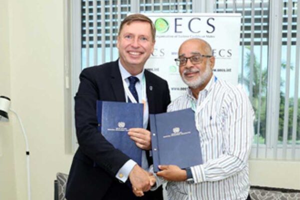 Mr. Stein Hansen Director of Special Operations United Nations Industrial Development Organisations (UNIDO) with OECS Director General Dr. Jules