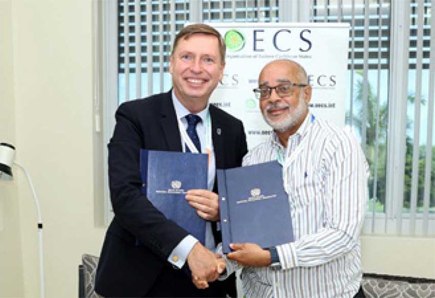 Mr. Stein Hansen Director of Special Operations United Nations Industrial Development Organisations (UNIDO) with OECS Director General Dr. Jules