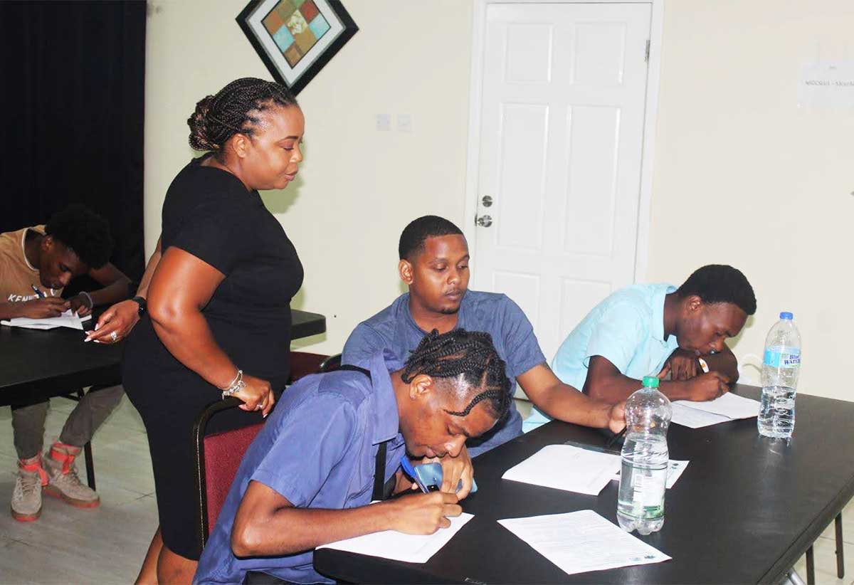 Ms. Swaitsha Antoine, Counselor at NSDC, engages youth athletes during an orientation session at NSDC on Thursday, June 20, 2024.