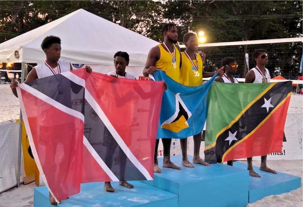 Team Saint Lucia displays gold medals on the podium 