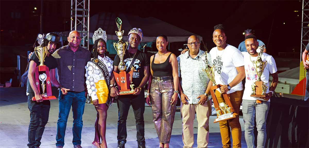 First and second place winners of the Groovy and Power Soca competitions with officials of the Carnival planning and management committee