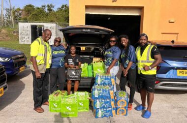 SAGICOR SUPPORTS: Members of Team Sagicor Grenada support the Hurricane Beryl relief effort with the donation of water and canned items to representatives of the National Disaster Management Agency