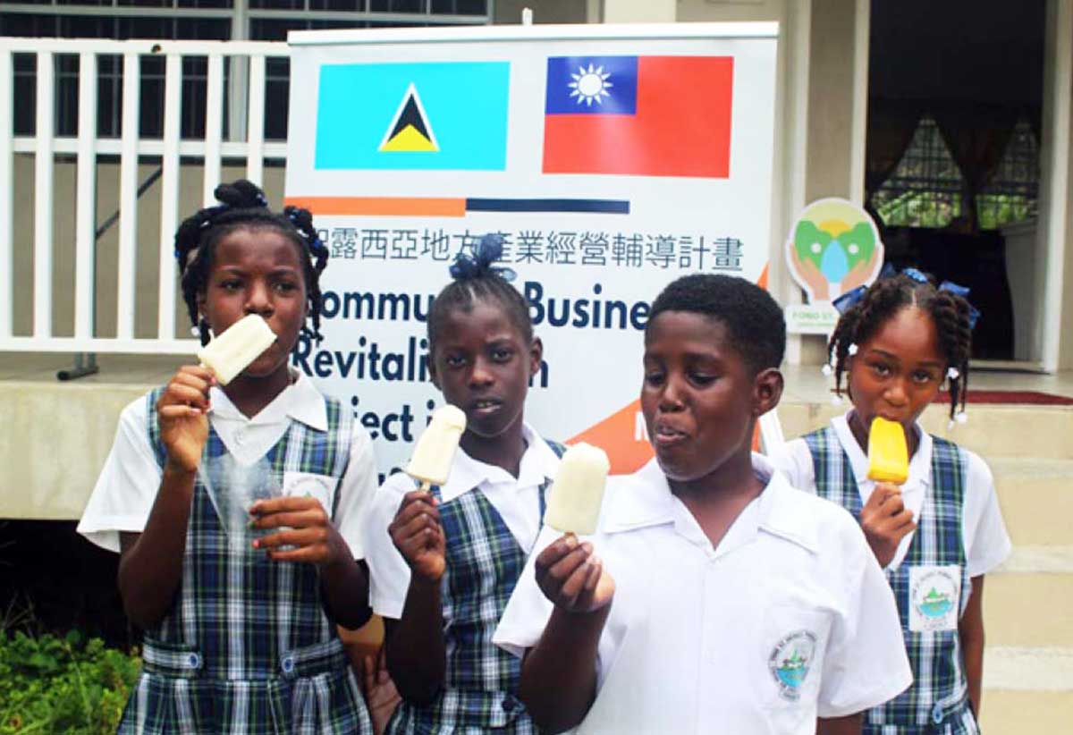 Students sampling their delicious fruit popsicles from Jacq-Co Valley Products Ltd