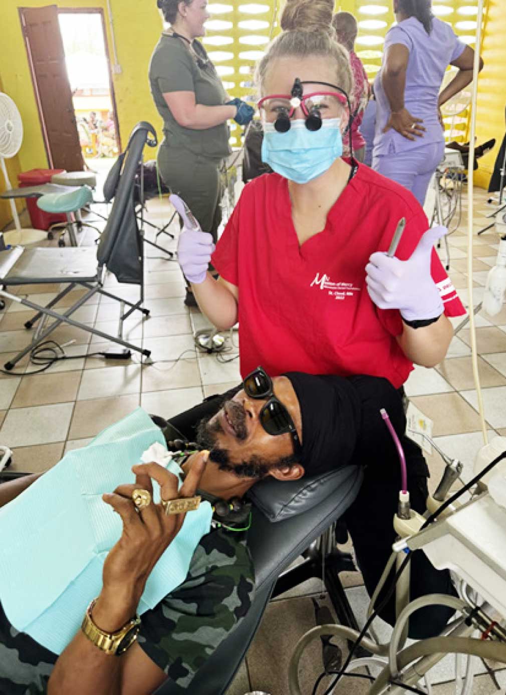 Dental professional from Great Shape! Inc. posing for a shot with patient