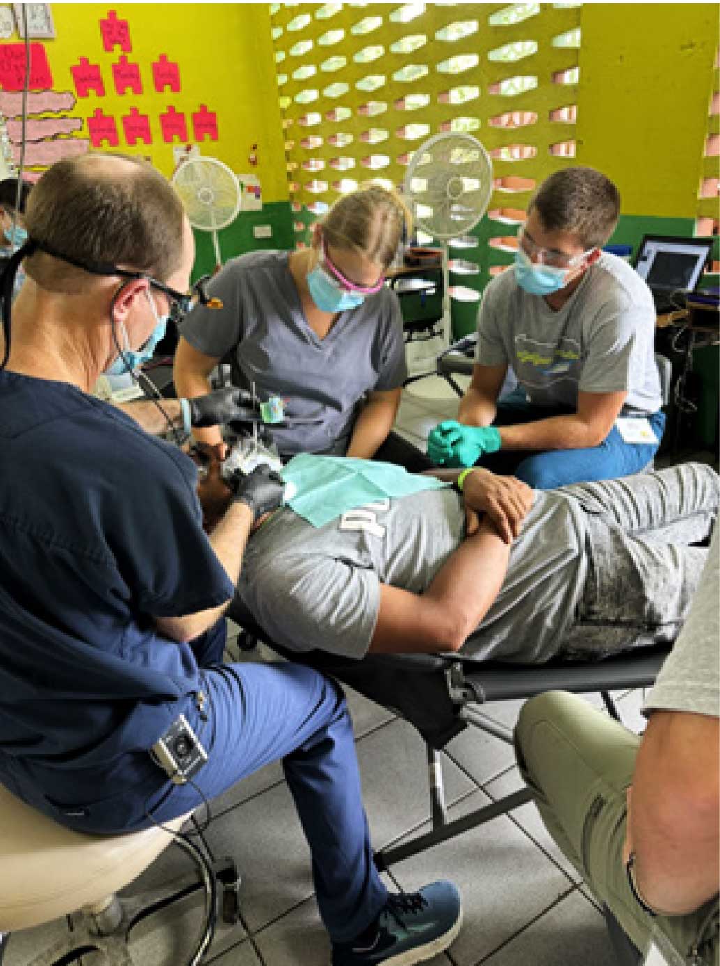 Great Shape! Inc. dental professionals and volunteers treating a patient at a free clinic