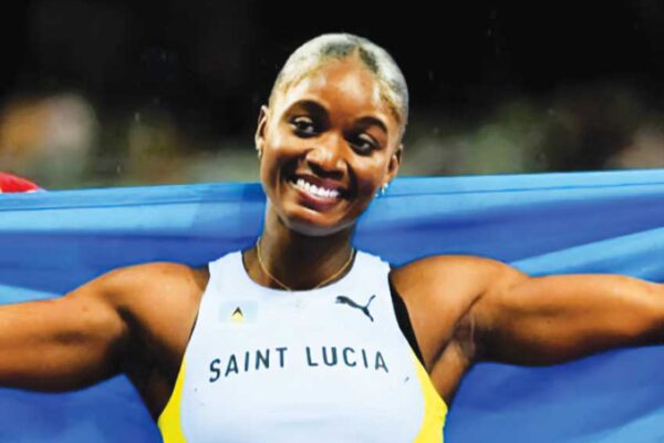 Julien Alfred celebrates her historic performance after copping gold in the women’s 100m at the 2024 Paris Olympics