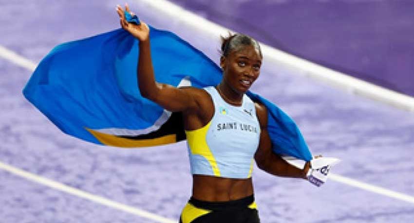 Julien Alfred celebrates her historic performance after copping gold in the women’s 100m at the 2024 Paris Olympics