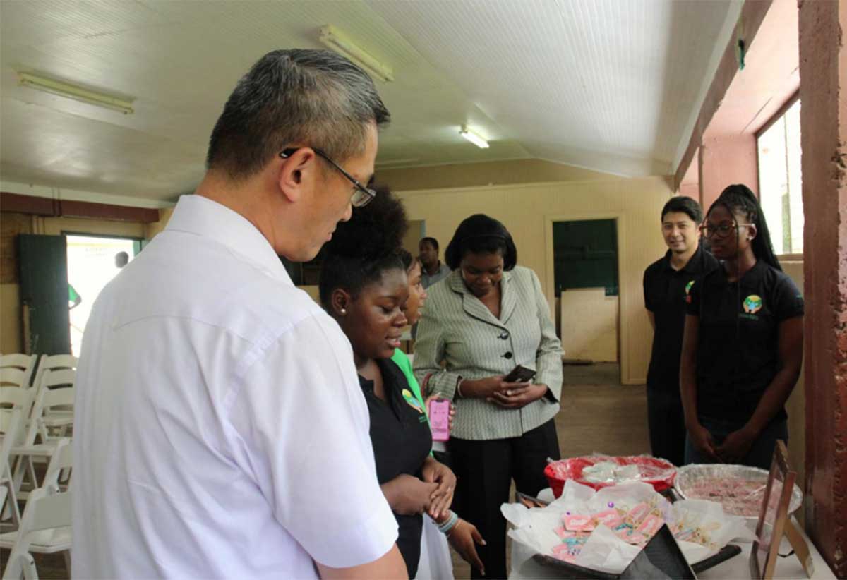 H.E. Peter Chia-Yen Chen, Taiwan’s Ambassador to Saint Lucia, and Hon. Emma Hippolyte, Minister for Commerce, engage summer camp participants during a tour