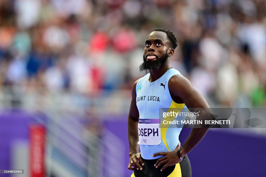 St Lucia's Michael Joseph reacts after competing in the men's 400m heat of the athletics event at the Paris 2024 Olympic Games at Stade de France in Saint-Denis, north of Paris, on August 4, 2024. (Photo by Martin BERNETTI / AFP) (Photo by MARTIN BERNETTI/AFP via Getty Images)