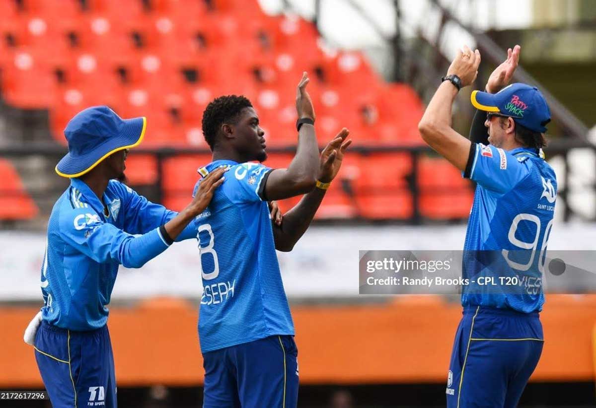 GEORGETOWN, GUYANA - SEPTEMBER 21: Alzarri Joseph (C) and David Wiese (R) of Saint Lucia Kings celebrate the dismissal of Quinton de Kock of Barbados Royals during the Men's 2024 Republic Bank Caribbean Premier League match 22 between Saint Lucia Kings and Barbados Royals at Guyana National Stadium on September 21, 2024 in Providence, Guyana. (Photo by Randy Brooks/CPL T20 via Getty Images)