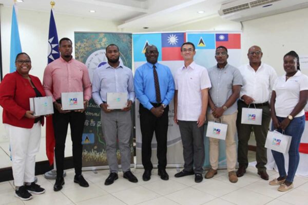 H.E. Peter Chia-Yen Chen, Taiwan’s Ambassador to Saint Lucia, joins Hon. Moses Jn. Baptiste, Minister for Health, Wellness and Elderly Affairs, and the six participants in the 2024 Taiwan Alumni Workshop Program, at the ceremony held at Union Orchid Gardens on Wednesday, September 4, 2024, for a group photo.