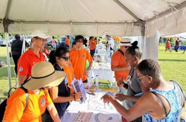 H.E. Peter Chia-Yen Chen, Taiwan’s Ambassador to Saint Lucia, and team members from the Taiwan Technical Mission (TTM) engage patrons at the TTM’s health booth at the Health Fair held at Grace Playing Field in Vieux Fort on Sunday, September 22, 2024.