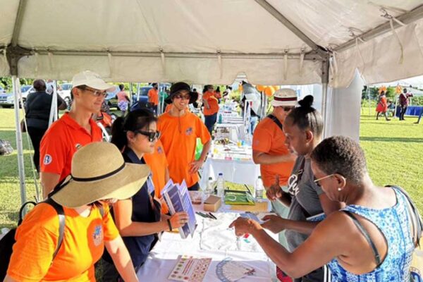 H.E. Peter Chia-Yen Chen, Taiwan’s Ambassador to Saint Lucia, and team members from the Taiwan Technical Mission (TTM) engage patrons at the TTM’s health booth at the Health Fair held at Grace Playing Field in Vieux Fort on Sunday, September 22, 2024.