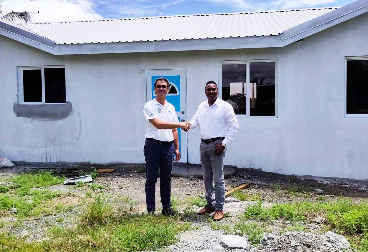 H.E. Peter Chia-Yen Chen, Taiwan’s Ambassador to Saint Lucia, and Hon. Jeremiah Norbert, Minister in the Office of the Prime Minister with Responsibility for Crime Prevention and Persons with Disabilities and Parliamentary Representative for Micoud North, shake hands outside the new Patience Early Childhood Development Centre which is now under construction during their site visit on Wednesday, September 11, 2024.