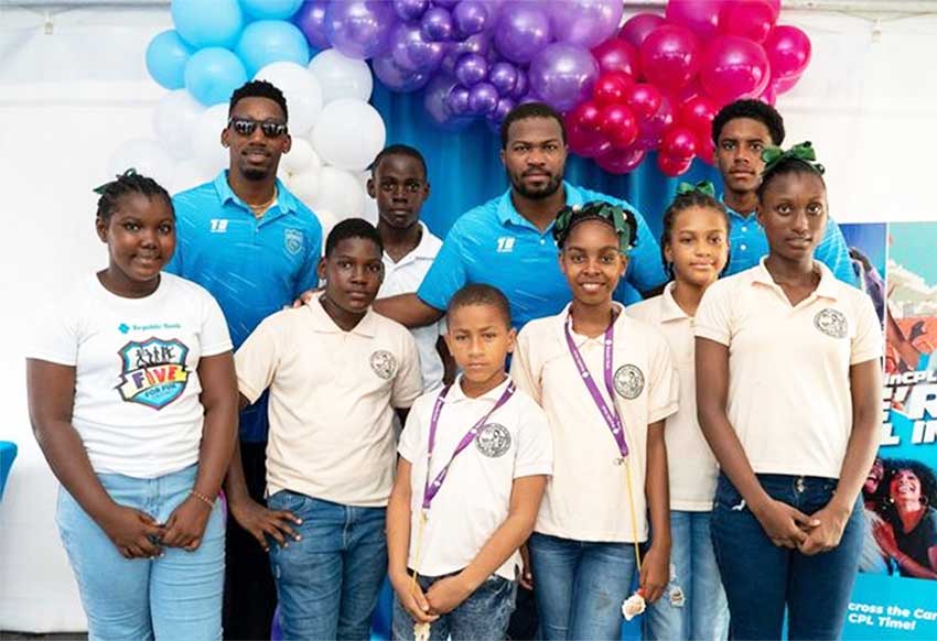 Saint Lucia Kings Khary Pierre, Johnson Charles and Ackeem Auguste with the 2024 Republic Bank Five For Fun Champions from The Riviere Doree Anglican Combined School