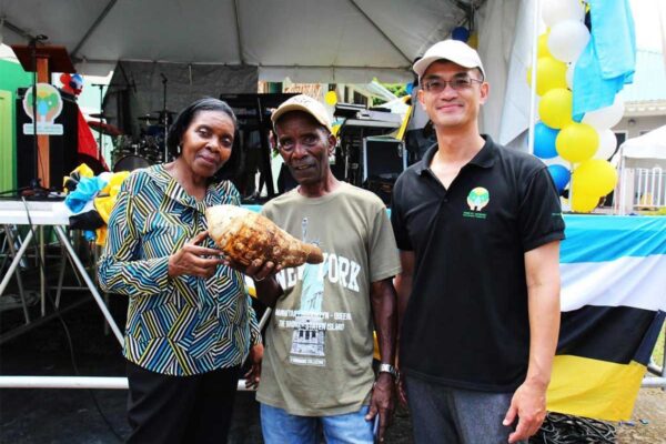 H.E. Peter Chia-Yen Chen, Taiwan’s Ambassador to Saint Lucia, and Hon.Emma Hippolyte, Minister for Commerce, Manufacturing, Business Development, Cooperatives and Consumer Affairs, and Parliamentary Representative for Soufriere/Fond St. Jacques, pose with the winner of the largest dasheen competition at the Dasheen Festival on Saturday, September 28, 2024.