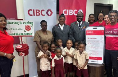 Captain Louis and the small S.A contingent surrounded by a small team from CIBC Caribbean led by Country Manager Nigel Ollivierre (R)