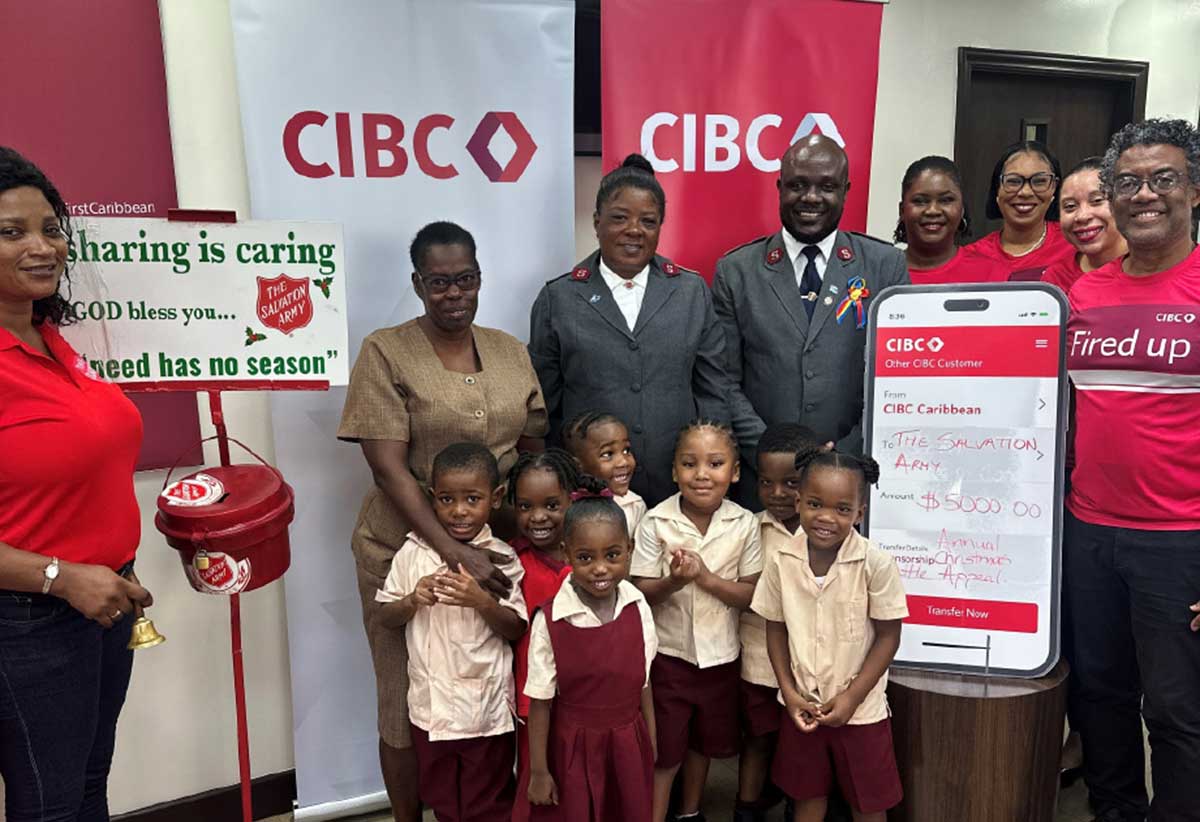 Captain Louis and the small S.A contingent surrounded by a small team from CIBC Caribbean led by Country Manager Nigel Ollivierre (R)