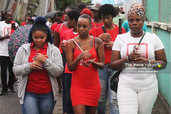 Joanna Joseph (extreme right), the mother of Arnold Joseph, wanted to set the record straight about her son, who she said was “a loving child.” [PHOTO: Allen Alexander]