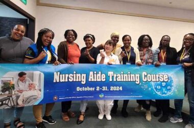 Mrs. Sylli Maqueda Valcin, Community Health Aide in the Ministry of Health, Wellness and Elderly Affairs, second from left, with other participants and trainer in the Nursing Aide Training Course.