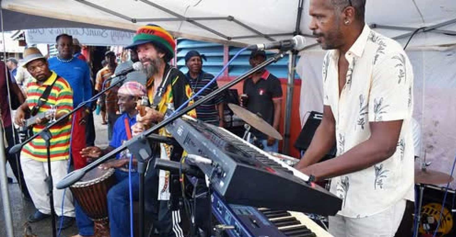 Musicians jamming free-style outside the Castries Market at a Cecilia’s Day presentation