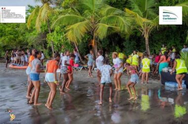 Participants engage in activities at the Anse Cochon beach