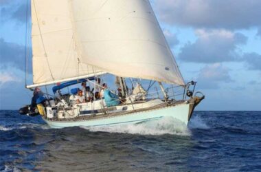 Penny Oyster (GBR) crosses the line in Saint Lucia at the end of ARC 2023 – [credit Tim Wright Photoaction]