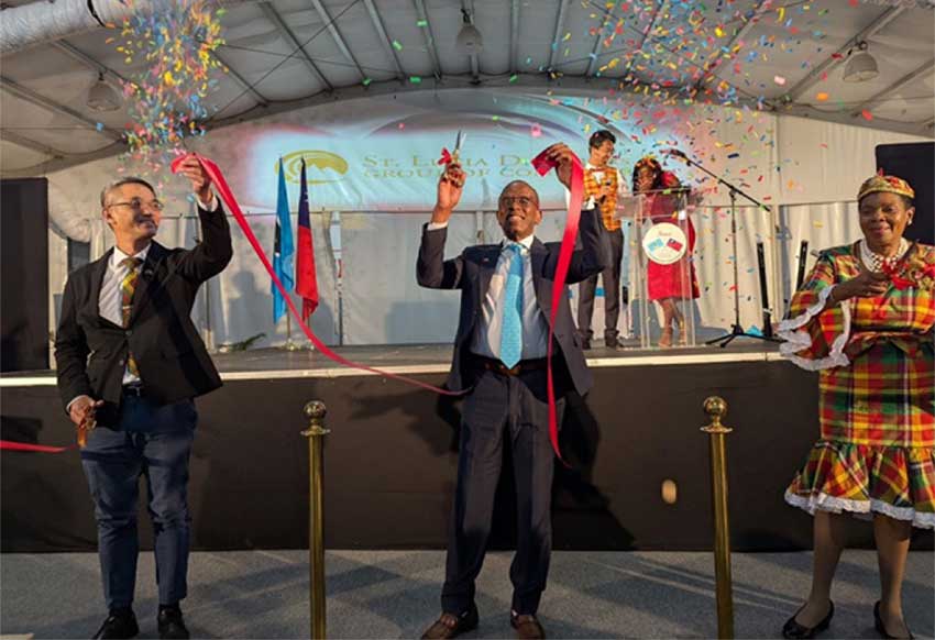 H.E. Peter Chia-Yen Chen, Taiwan’s Ambassador to Saint Lucia, joins Hon. Philip J. Pierre, Prime Minister and Minister for Finance, Economic Development and Youth Economy, and Minister for Justice and National Security, and Hon. Emma Hippolyte, Minister for Commerce, Manufacturing, Business Development, Cooperatives and Consumer Affairs, for the ribbon cutting at the opening ceremony on Thursday evening, October 31, 2024, at The Pavilion on the Ramp, Rodney Bay