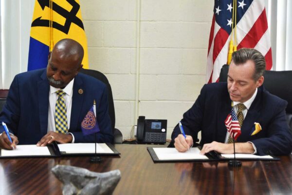 Executive Director of the RSS, Rear Admiral Errington Shurland, and Ambassador of the United States to Barbados, the Eastern Caribbean, and the OECS, Roger Nyhus, signing an amended Letter of Agreement ushering in an additional USD 2.6 million in support of efforts to enhance security in the RSS Member States