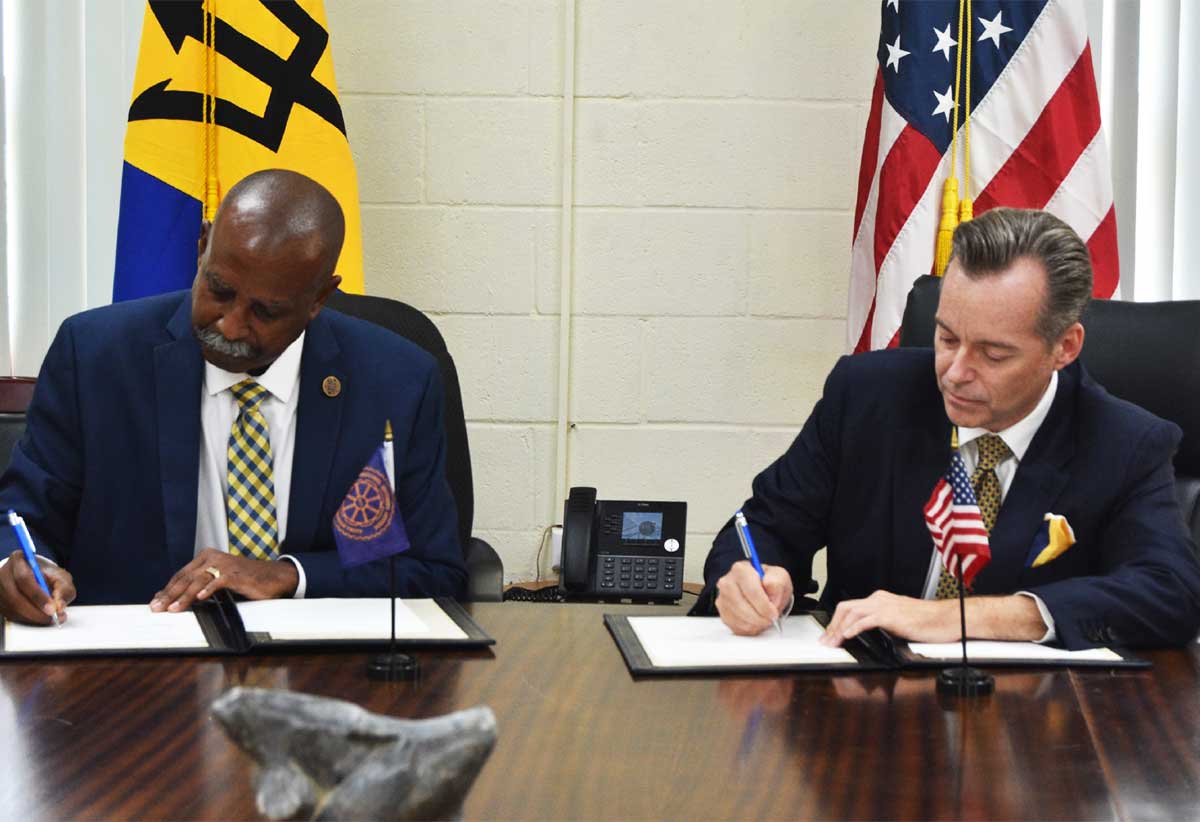 Executive Director of the RSS, Rear Admiral Errington Shurland, and Ambassador of the United States to Barbados, the Eastern Caribbean, and the OECS, Roger Nyhus, signing an amended Letter of Agreement ushering in an additional USD 2.6 million in support of efforts to enhance security in the RSS Member States