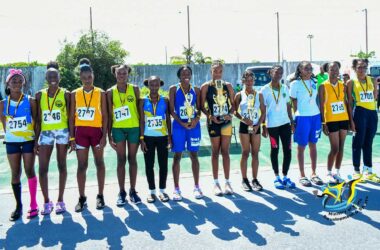 Athletes displaying their Trophies and medals at the Inter-Secondary School Road Races