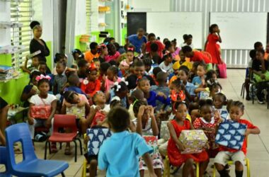 Children from the Bishop Charles Gachet RC School awaiting their Christmas gifts from Sandals