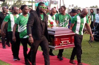 Pall-bearers from the Vieux Fort Football League carrying the casket