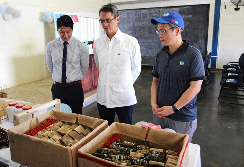 At the graduation ceremony held at Bordelais Correctional Facility on Wednesday, November 27, 2024, H.E. Peter Chia-Yen Chen, Taiwan’s Ambassador to Saint Lucia, centre, Mr. Daniel Lee, Chief of the Taiwan Technical Mission (TTM), at left, and Mr. Hugo Lo, Agriculture Specialist at the Taiwan Technical Mission (TTM), at right, inspect the soaps made by the inmates.