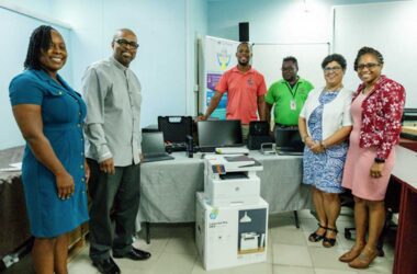 Minister Joachim Henry (2nd from left) and other officials at the handover ceremony…