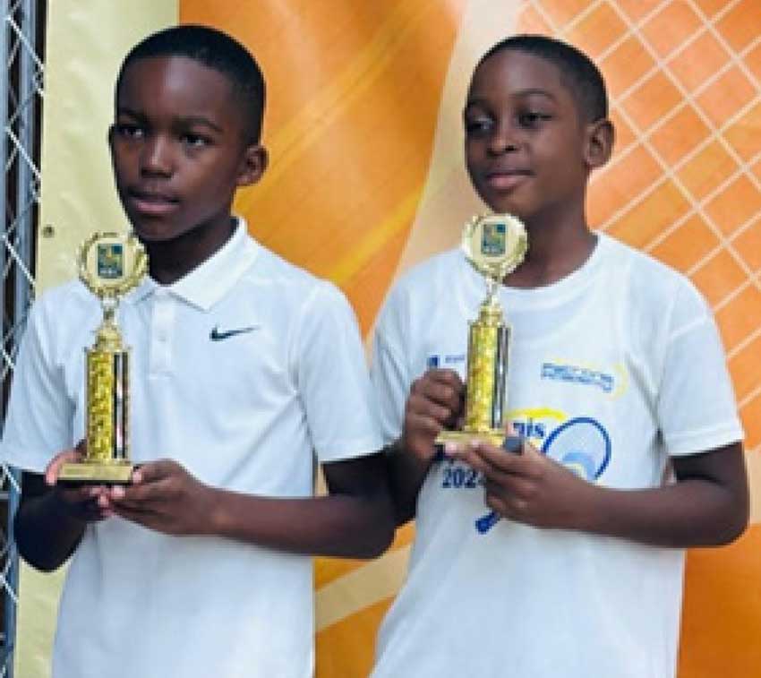 Riley and Kimari display the Doubles Championship Trophy