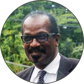 Dr. Velon John, OBE, SLC