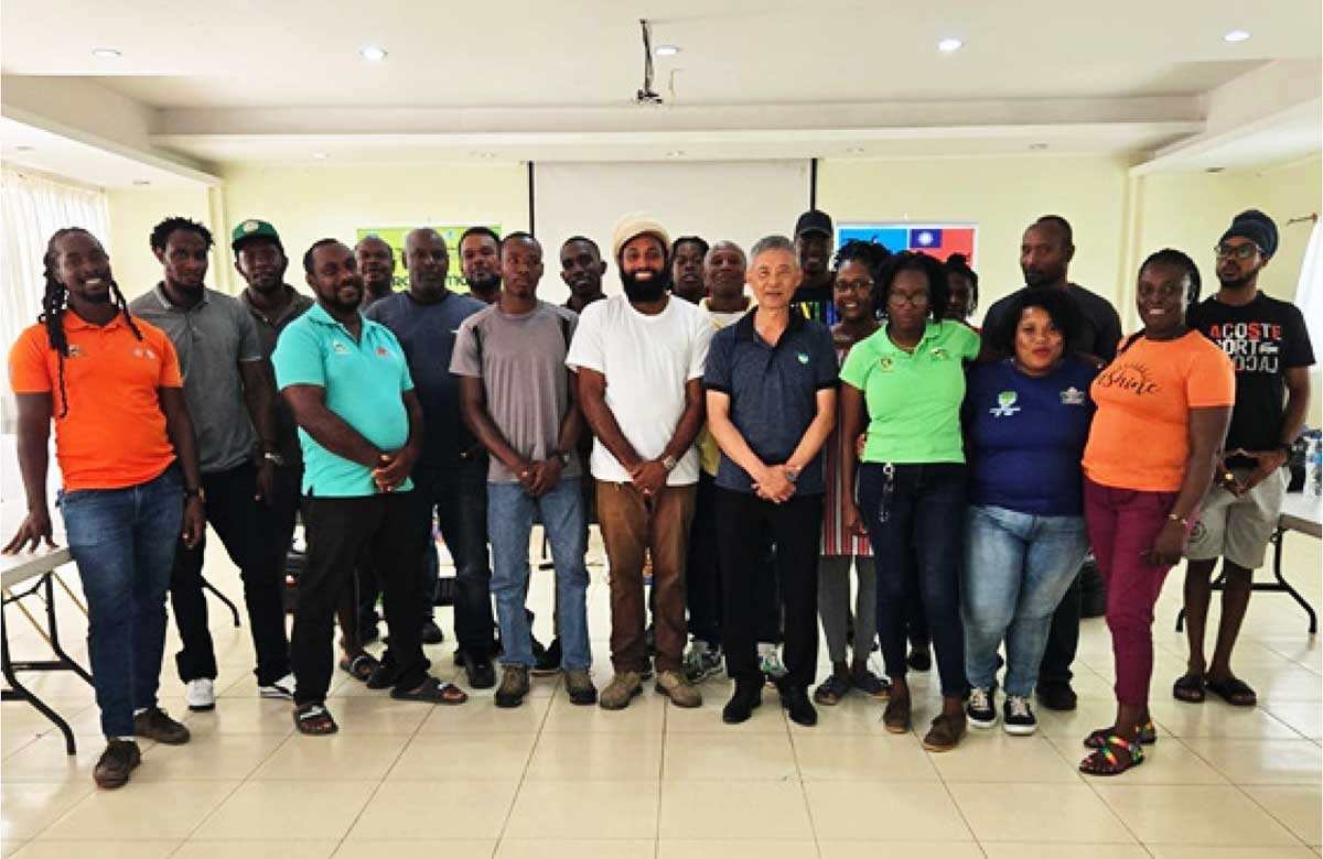 Mr. Johnson Yang, Senior Specialist in the Production Unit under the Seven Crops Project, and Mr. Edward Wilson, Production Officer, with other members of the Taiwan Technical Mission, extension officers and farmers who attended the informative seedless watermelon training workshop on Thursday, February 27, 2025