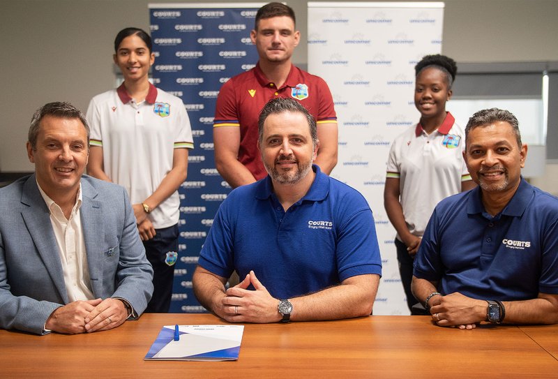 The partnership deal was recently signed in Trinidad by (sitting Left to Right) CWI's Chief Commercial Officer, Rupert Hunter; and VP & Managing Director for Courts Caribbean, Felix Siman; who was accompanied by Regional Marketing Director, Feisal Muradali. Witnessing the signing were West Indies Players (standing Left to Right) Shunelle Shaw, Joshua Da Silva, and Djenaba Joseph