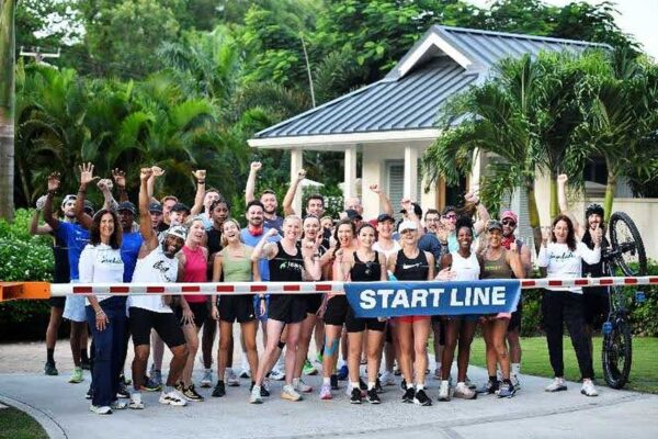 Day 1: Athletes and organizers share a moment at the start of the Sandals Foundation Island Challenge. The four-day event aims to raise ÂŁ100,000 to purchase lifesaving equipment for the Special Care Baby Unit at the Millenium Heights Medical Complex.