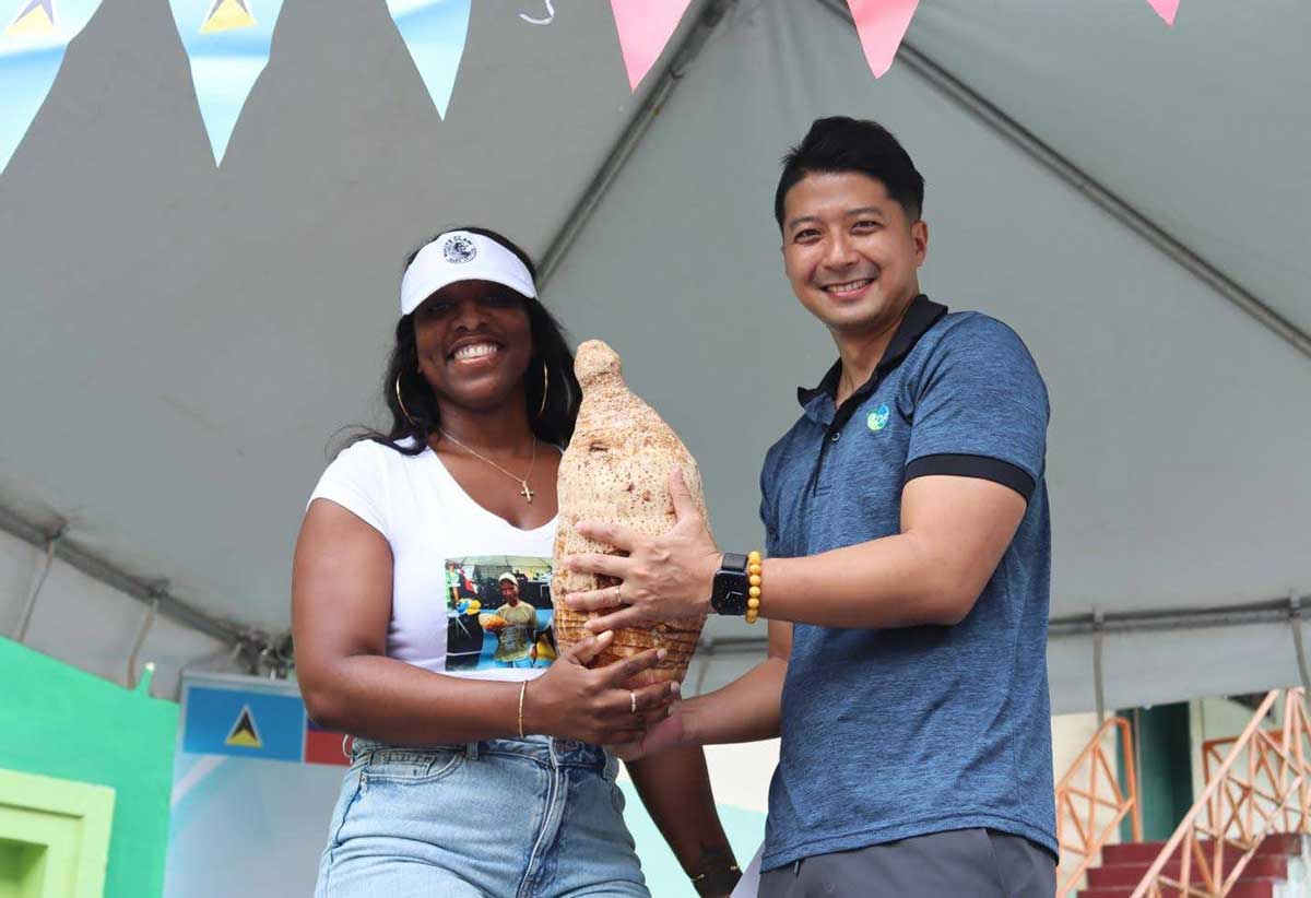 Mr. Daniel Lee, {right}, with Ms. Stephanie Moses, the winner of the Biggest Dasheen Competition (Photo credit: TTM)
