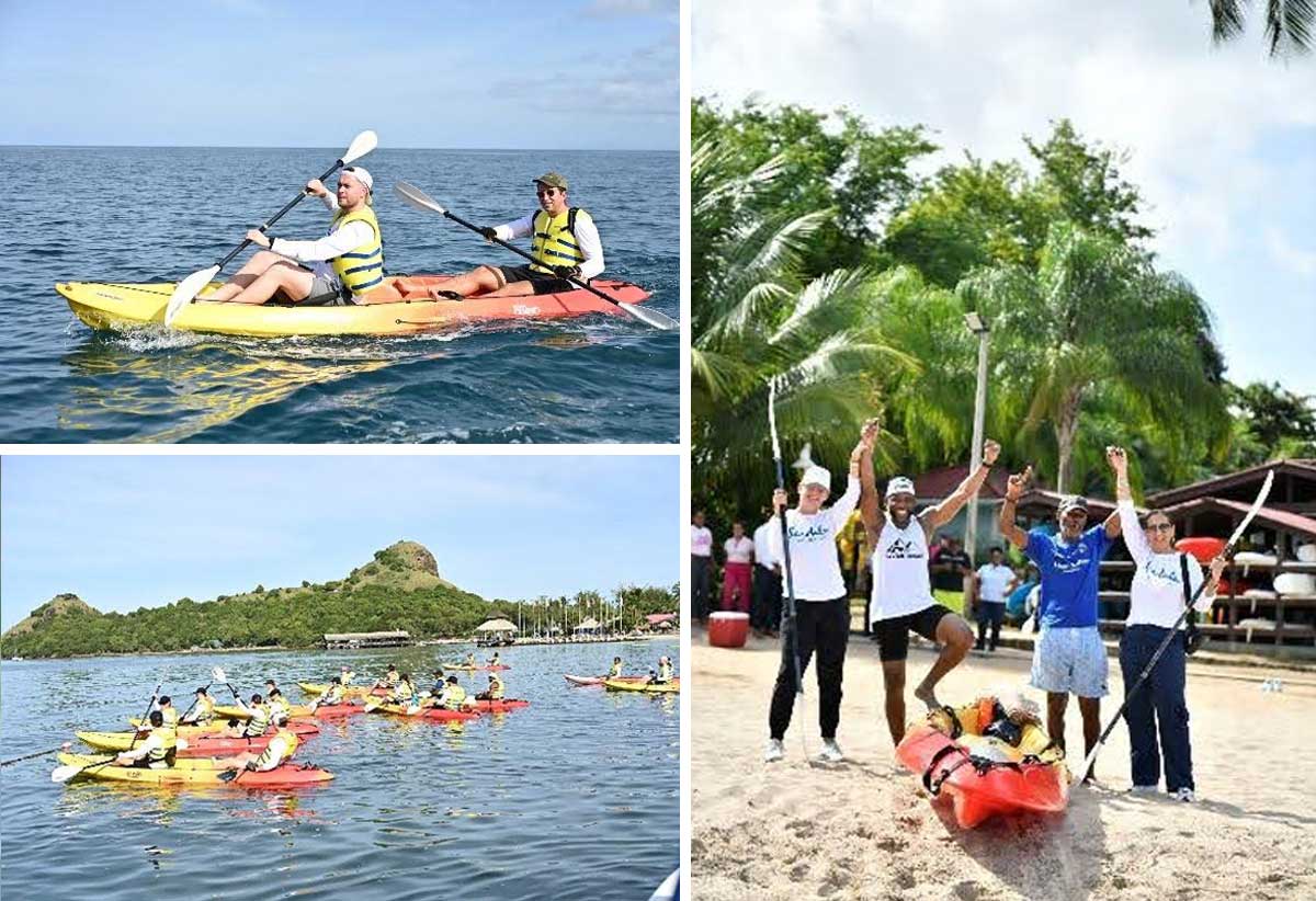 Day 1: First team across the finish line, local participants Julien Toussaint (left) and Victor Ledger pose with Heidi Clarke, Executive Director Sandals Foundation (left) and Karen Zacca, Director of Operations at Sandals Foundation (on the right) after a 10Km run from Sandals Halyon Resort to Sandals Grande Resort and a 10 Km kayak back.
