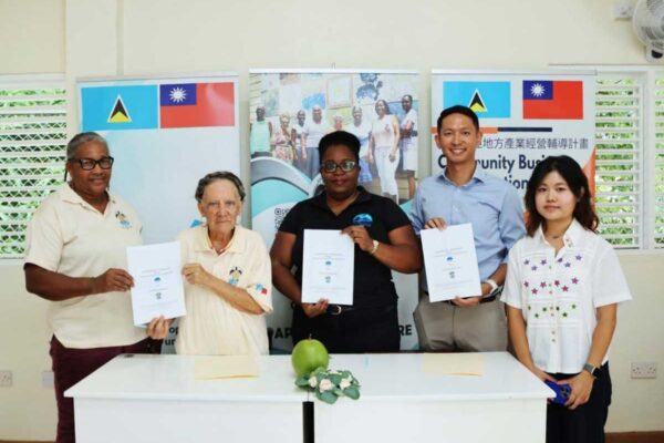 From left to right: Ms. Noella Alexander, Secretary of Anse Kawet Crafters, Mrs. Avice James-Louisy, President of Anse Kawet Crafters, Ms. Stephia Hippolyte, Manager for Product & Business Development for The Signature Travel Group Inc., Mr. Louis Tsou, Project Manager for the Community Business Revitalization Project (CBRP), and Ms. Kinsley Feng, intern at the Taiwan Technical Mission, at the MoU signing in Laborie on Wednesday, October 8, 2025. (Photo Credit : TTM)