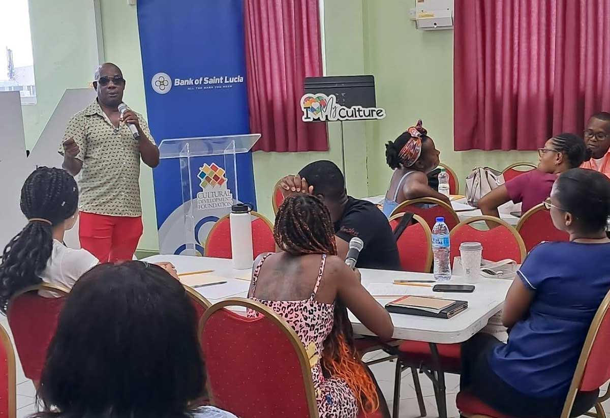 MC Gilroy “Ezi” Hall tutors participants on emceeing skills [Photo credit :CDF]